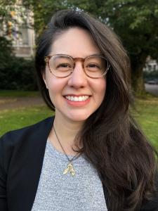 Marie Spiker, a young white woman with large tortoiseshell glasses and long dark brown hair