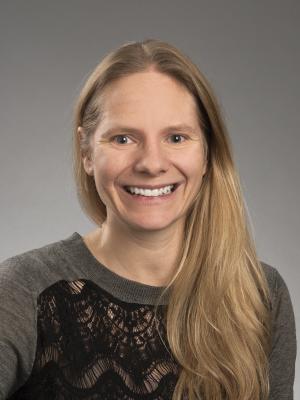 Dr Curl, a young white woman with long blond hair