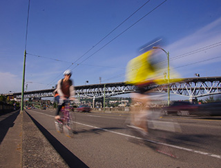 Bikers in front of seattle bridge