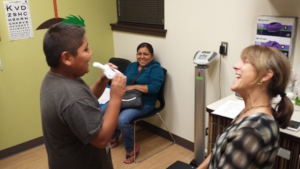 Dr. Karr and participant performing spirometry. Photo by HAPI Project.