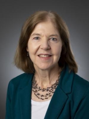 Dr Cullen, an older white woman with brown hair